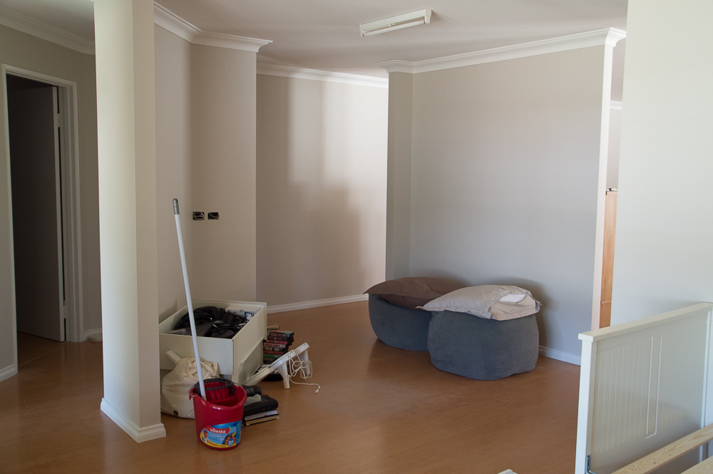 After Kenny sunk the external conduit into the wall where it should have been put, Frank's painters made it look like it had never been there (aside from the holes awaiting points)