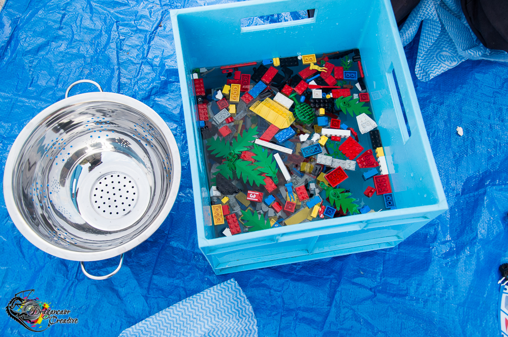 While we've heard some amazing LEGO washing suggestions, because this is loaned we went with handwashing.