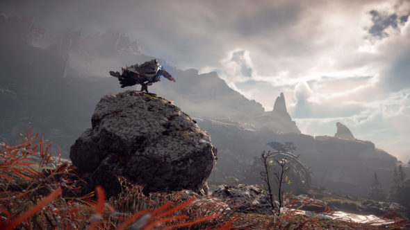 Screenshot of Horizon Zero Dawn. A machine bird sits on a boulder under a mostly overcast sky.