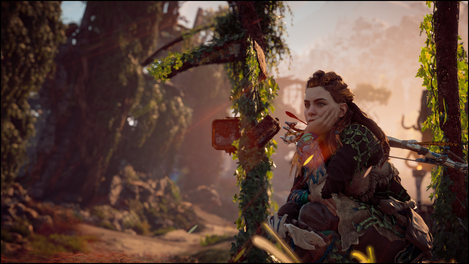 Screenshot of Horizon Zero Dawn. Aloy sits with her chin resting on her hand, her elbow braced on her lap. A ruined city lies behind her, overgrown & lit with the gold of sunrise